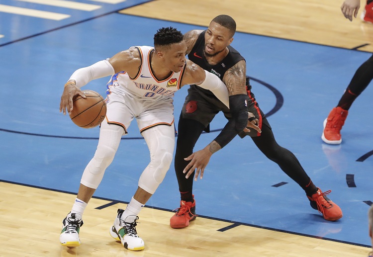 Damian Lillard defends during the NBA playoff against the Thunder