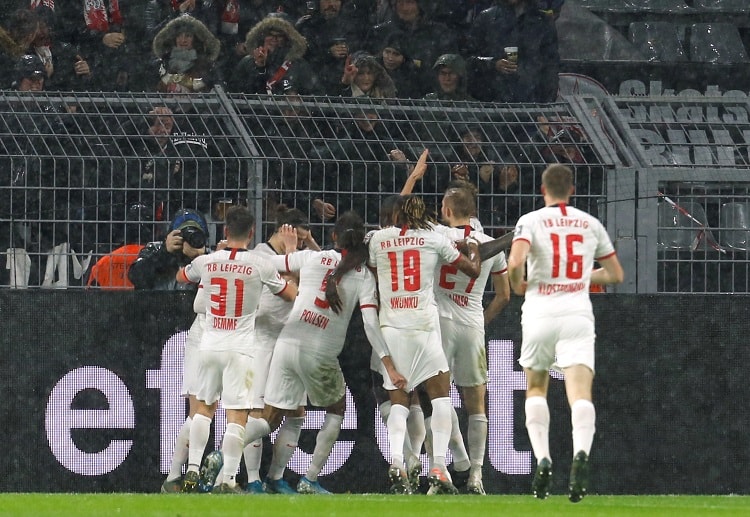RB Leipzig maintain their position atop the Bundesliga table after drawing against Dortmund