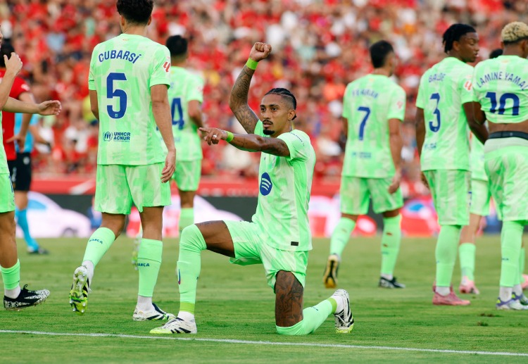 Barcelona’s Raphinha opens the scoring and celebrates in their La Liga fixture at Mallorca